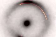 Astronomers detect unseen dark mass shaping distant galaxy light